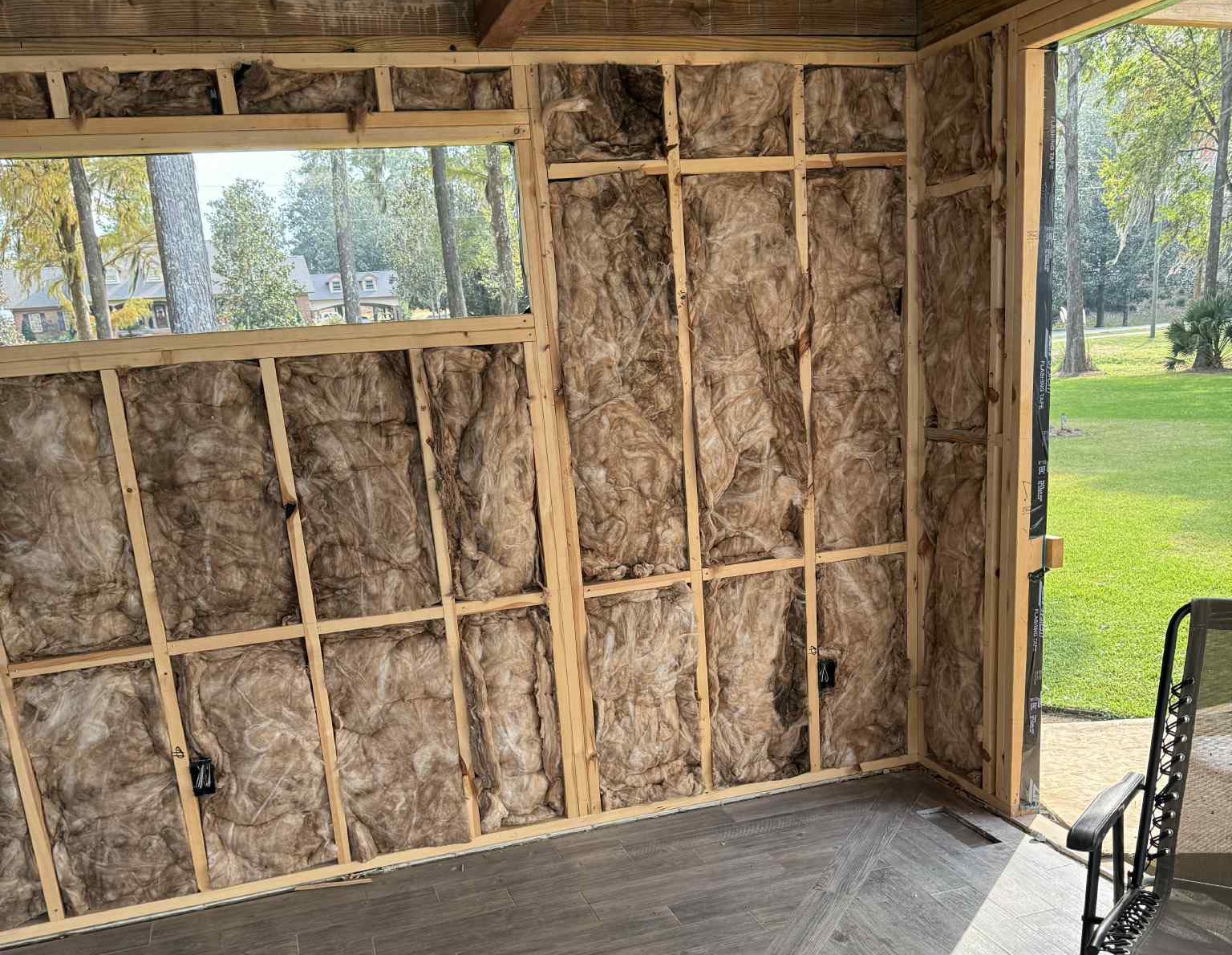 Fiberglass batt insulation installed in wall cavities
